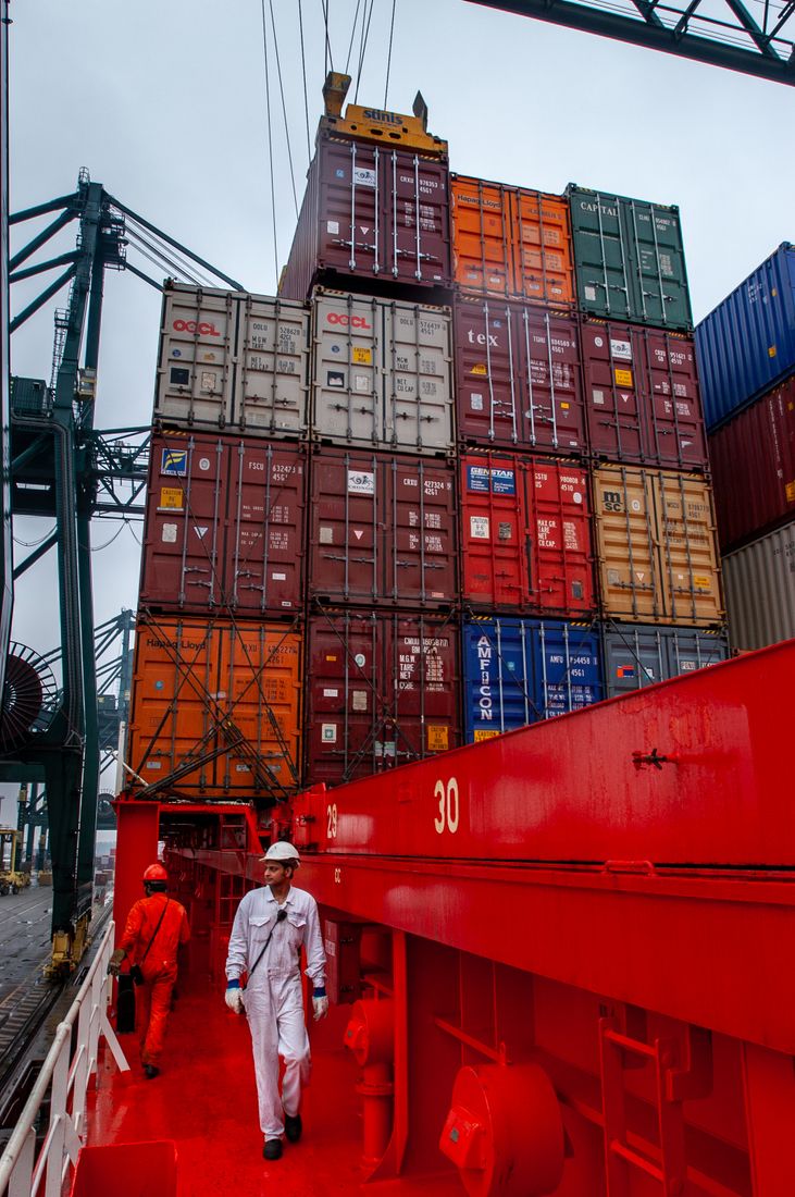 Crew on a container vessel at port